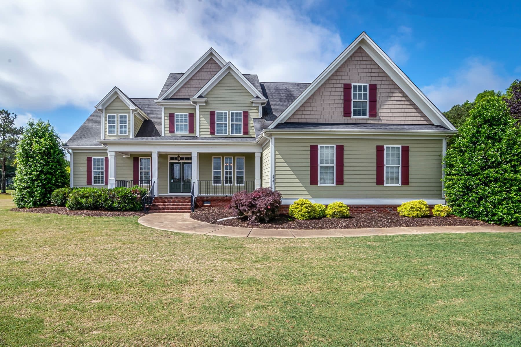 A two-storey American home with double-hung windows across both floors